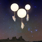 Whimsical bear night lights hanging from glowing balloons against a starry night sky, perfect for children's room decor and ambient lighting.