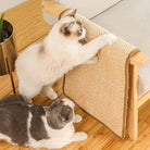 Cats using a sisal scratcher mat on a wooden chair, ideal for pet furniture protection. Durable, natural fiber cat scratch pad for indoor use.