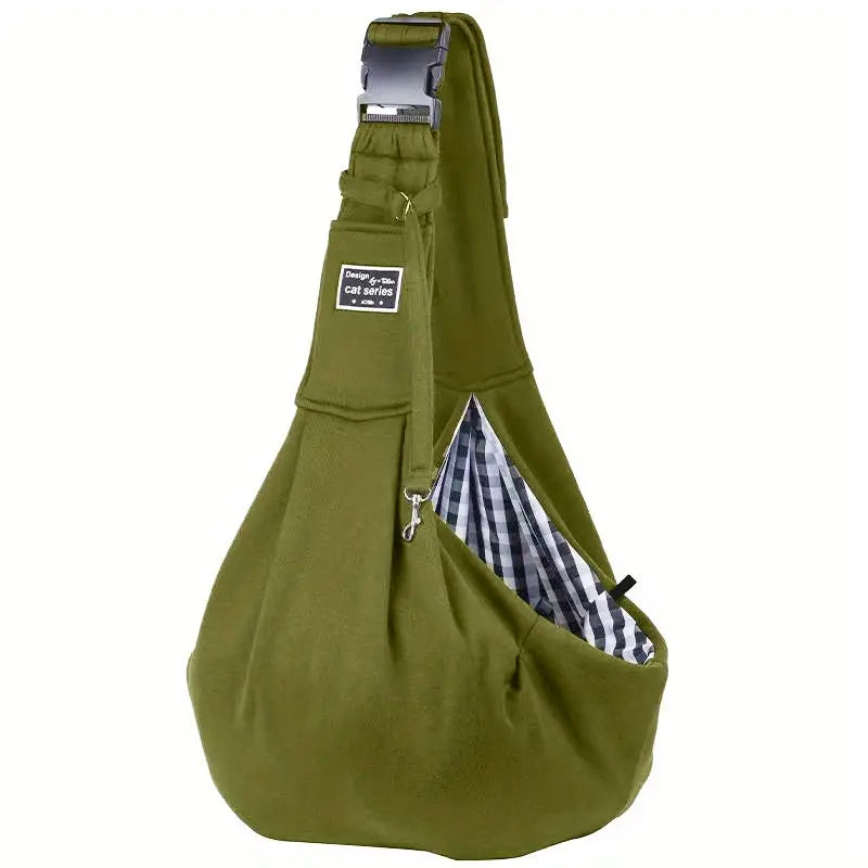 Green pet sling carrier with adjustable strap and checkered interior, ideal for small dogs and cats. Comfortable, hands-free design for easy travel.