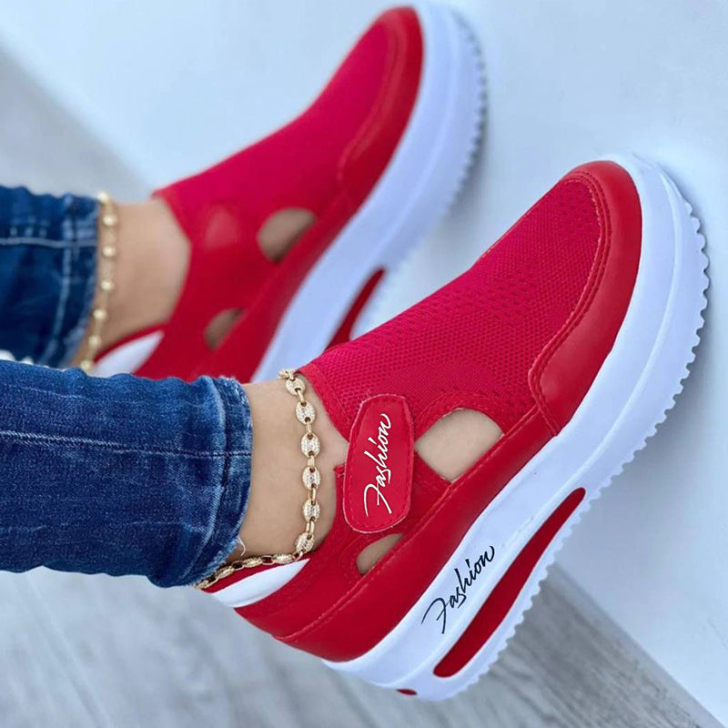 Red platform sneakers for women with breathable mesh design, round toe, and white sole. Stylish casual shoes ideal for running and everyday wear.