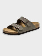 Dark gray two-strap sandal with adjustable buckles, cork footbed, and rubber sole. Comfortable, stylish footwear for casual wear.