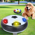 Hover soccer ball toy with LED lights on grass, featuring a playful dog wearing glasses. Ideal for indoor games, kids, and pet entertainment.