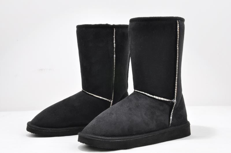 Black suede winter boots with white stitching, mid-calf height, and flat soles on a white background. Cozy footwear for cold weather.