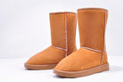 Tan suede winter boots with plush lining, featuring a mid-calf design and durable sole. Ideal for cold weather fashion and comfort.