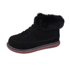 Black suede winter boot with faux fur collar, lace-up design, and brown rubber sole. Ideal for cold weather fashion and comfort.