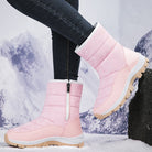 Pink winter snow boots with side zipper, rugged soles, and insulated lining, perfect for cold weather. Stylish women's footwear for snowy conditions.