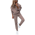 Woman in taupe hoodie and joggers set, casual loungewear, white sneakers, fashion outfit.