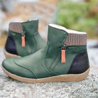 Green leather ankle boots with side zippers, plaid accents, and rubber soles, perfect for casual wear. Stylish women's footwear, comfortable design.