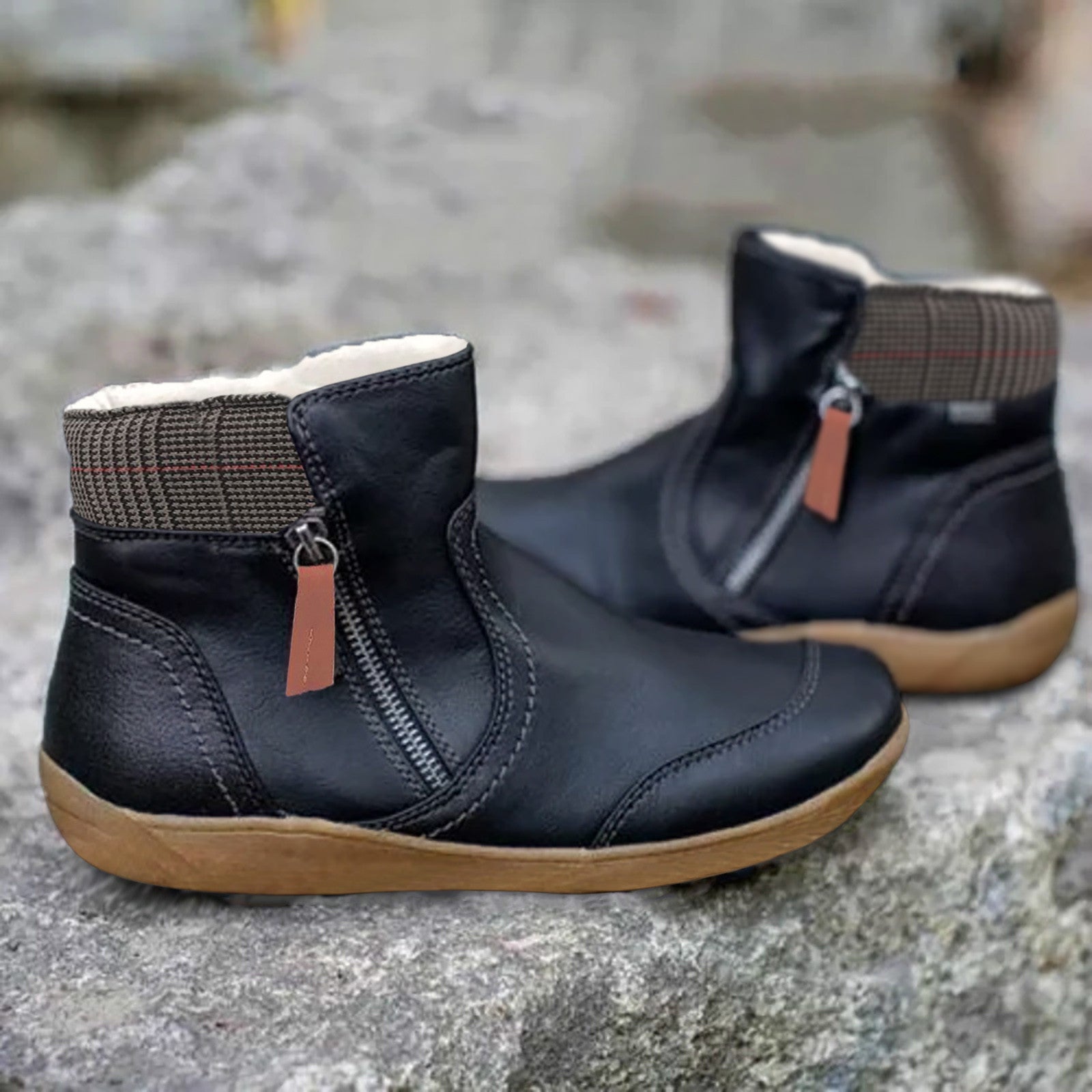 Black leather ankle boots with side zippers and plaid accents, featuring a cozy fleece lining and durable rubber soles, perfect for casual wear.