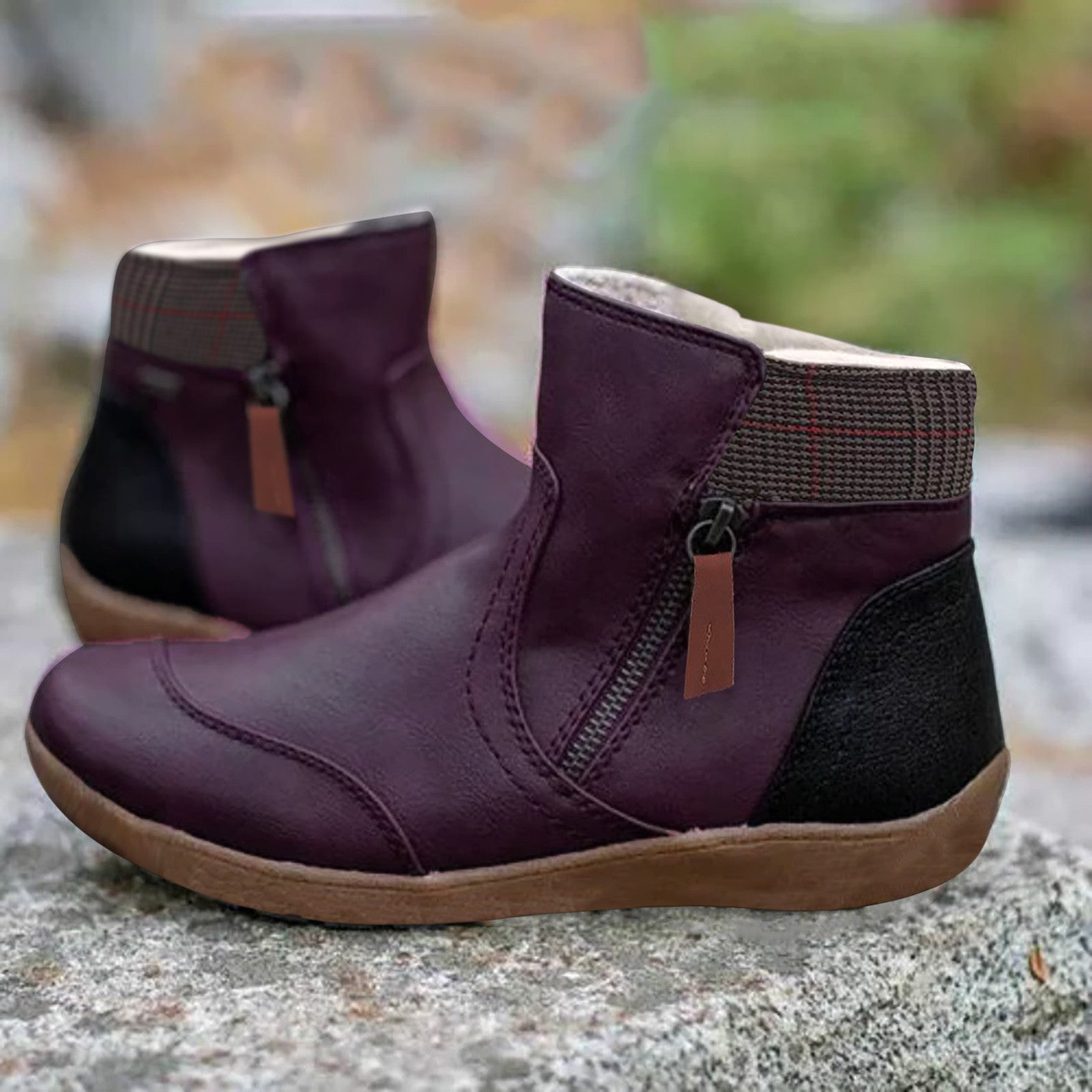 Women's purple leather ankle boots with side zippers, plaid accents, and rubber soles, perfect for casual wear. Stylish, comfortable footwear.