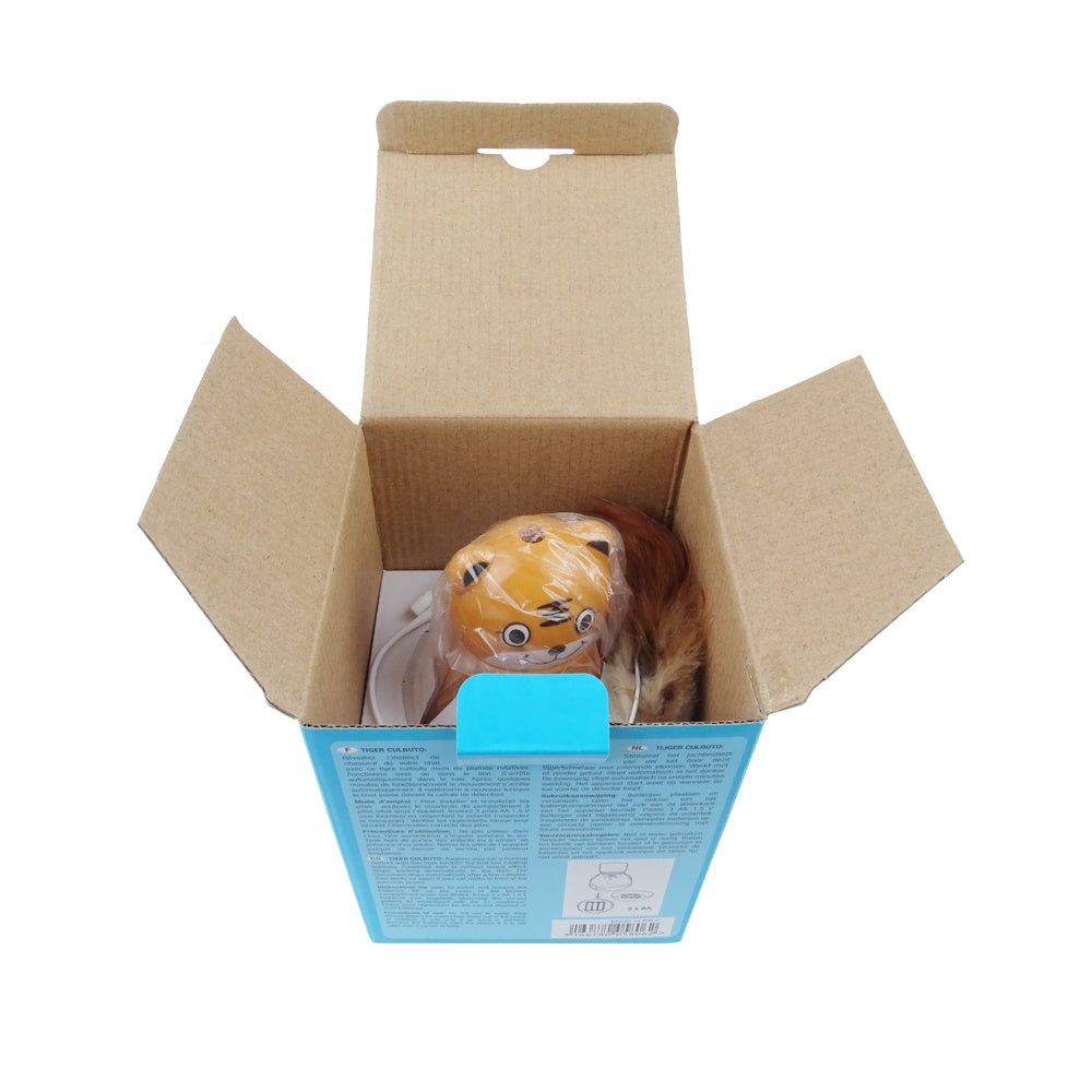 Open cardboard box with a brown toy cat inside, wrapped in plastic. Blue packaging with text visible. Ideal for toy unboxing and packaging keywords.