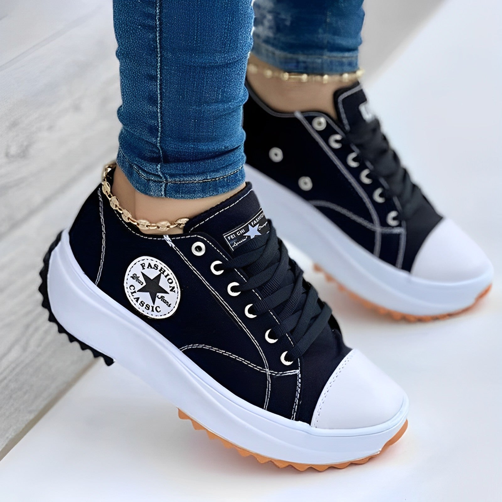 Black platform sneakers with white soles and toe caps, featuring a "Fashion Classic" logo. Stylish women's casual footwear, perfect for everyday wear.