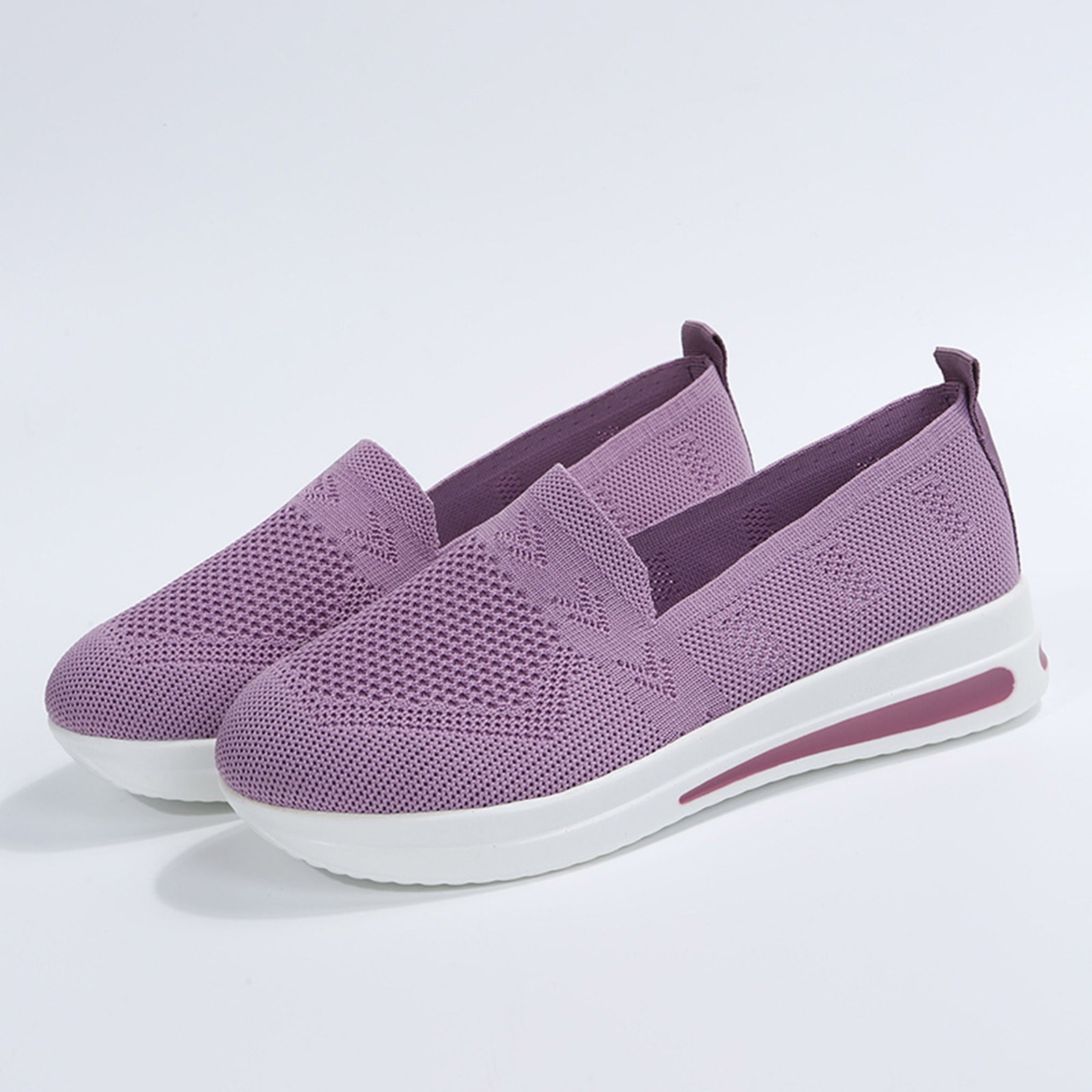 Purple slip-on sneakers with breathable mesh upper and white platform sole, ideal for casual wear. Lightweight, comfortable women's footwear.