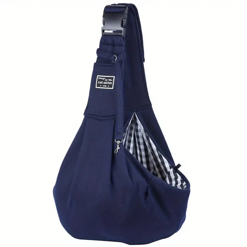 Navy blue pet sling carrier with adjustable strap and checkered lining, ideal for small dogs and cats. Comfortable, hands-free design for travel.