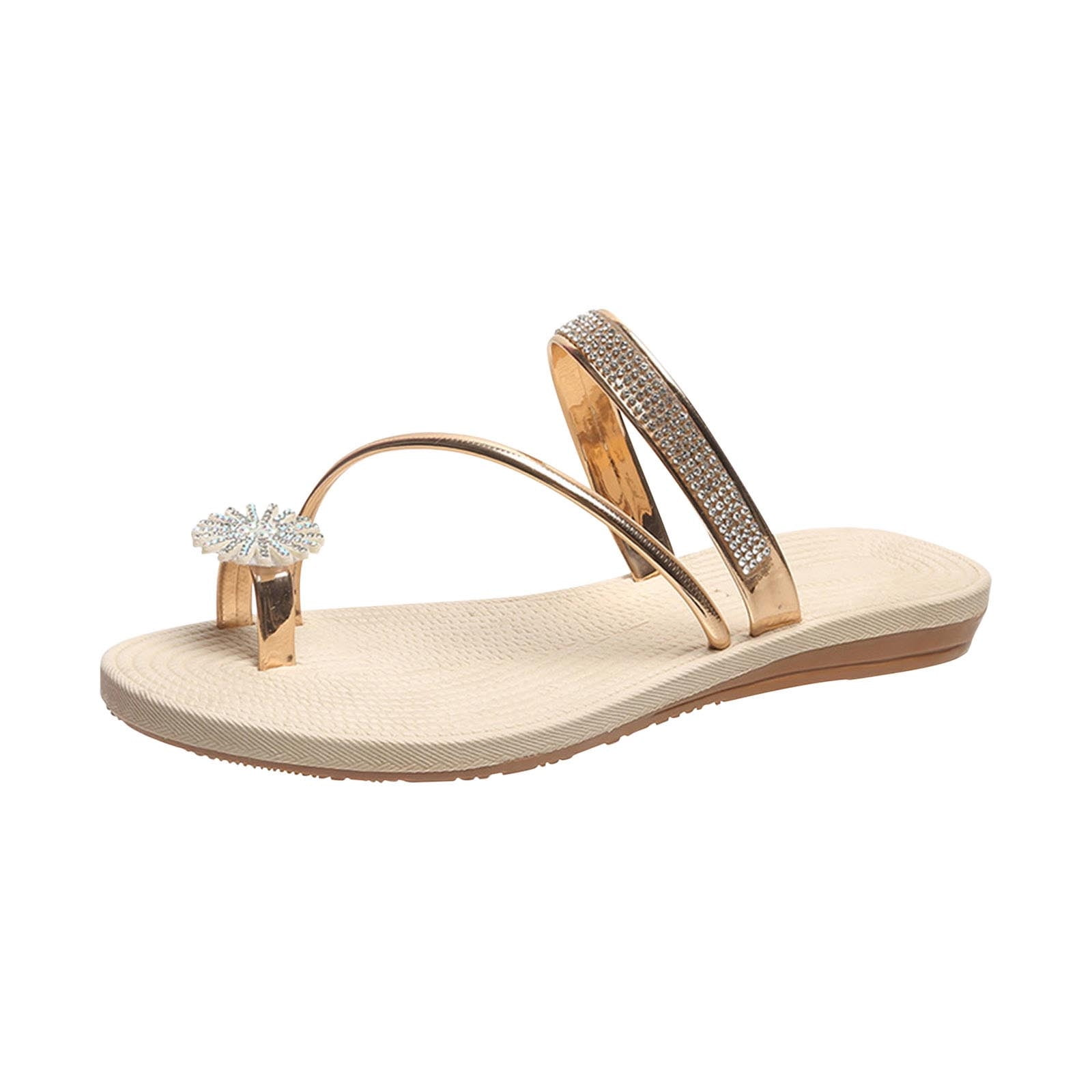 Gold women's sandal with rhinestone embellishments, featuring a flat sole and decorative flower detail. Perfect for summer fashion and casual wear.