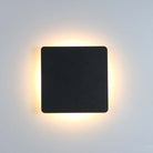 Modern black square LED wall sconce with soft ambient lighting, minimalist design, energy-efficient home decor, perfect for contemporary interiors.