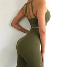 Olive green women's activewear set with decorative back stripes, featuring a crop top and high-waisted leggings. Stylish gym outfit for workouts.