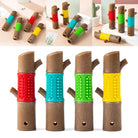 Colorful dog chew toys shaped like tree branches with textured grips in red, blue, green, and yellow. Durable pet dental care products.