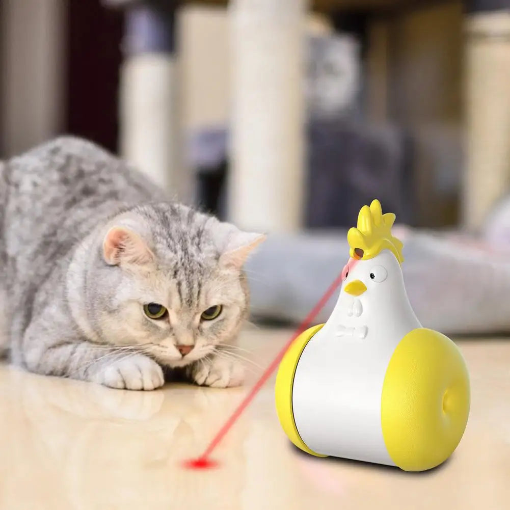 Cat playing with chicken-shaped laser toy on floor; interactive pet toy, cat entertainment, laser pointer for cats, playful kitten activity.