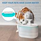 Cat drinking from automatic pet water fountain; modern design, white and turquoise colors. Ensures clean, fresh water for pets. Ideal for cats and dogs.