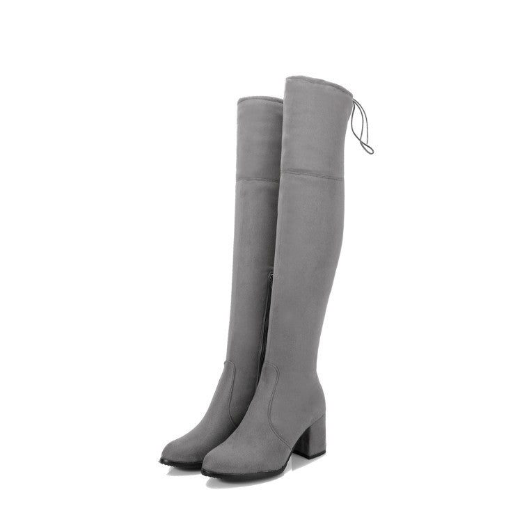 Gray over-the-knee suede boots with block heels, featuring a sleek design and back tie detail. Perfect for stylish winter fashion and versatile wear.