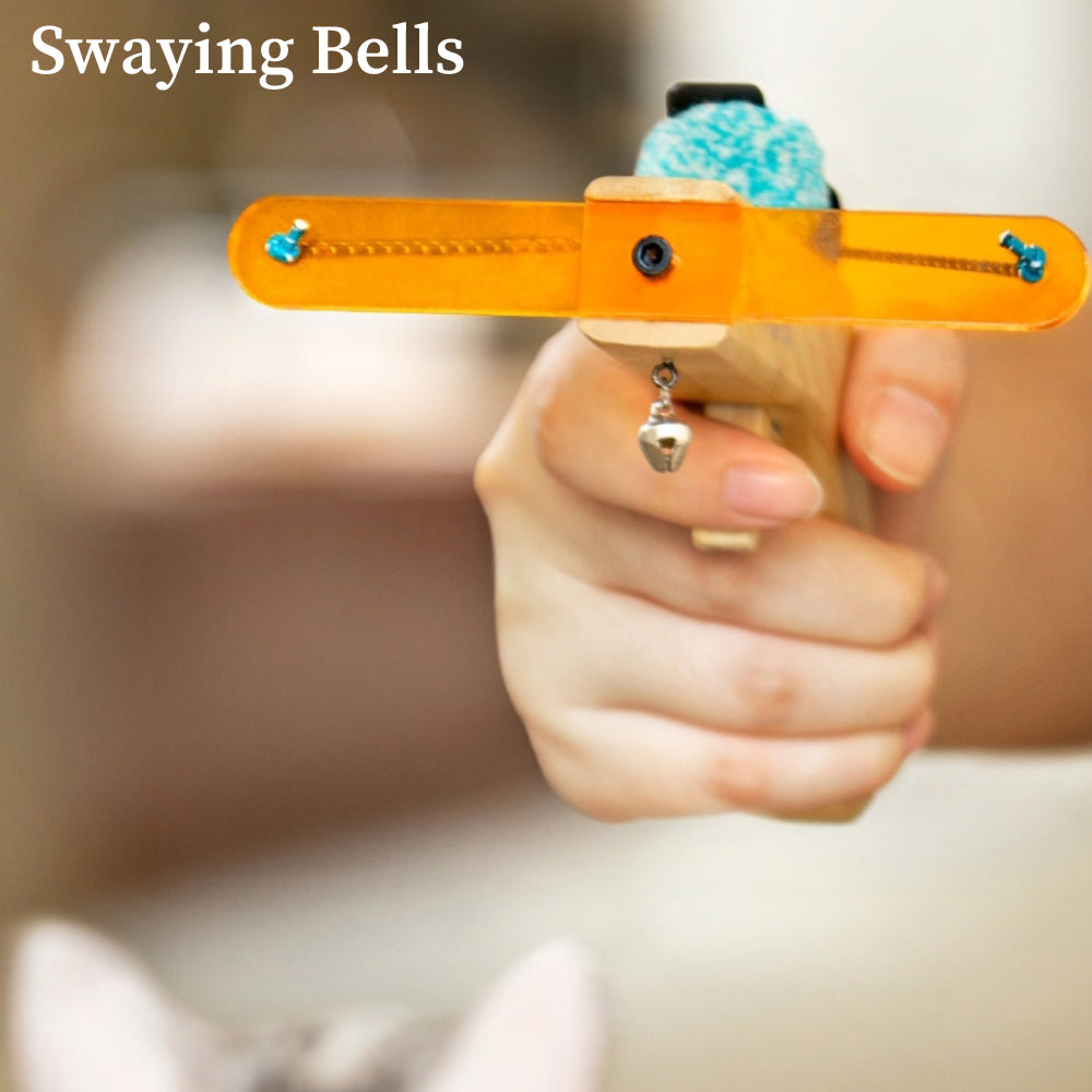 Cat toy launcher with orange handle, blue plush ball, and dangling bell. Interactive pet toy for cats, promoting exercise and play.