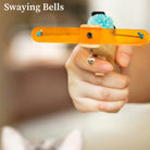 Cat toy launcher with orange handle, blue plush ball, and dangling bell. Interactive pet toy for cats, promoting exercise and play.