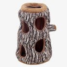 Plush tree trunk dog toy with multiple holes, designed for pet enrichment and interactive play. Ideal for dogs and cats. Durable and engaging pet toy.