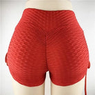 Red high-waisted textured sports shorts, ruched design, elastic waistband, women's activewear, gym workout clothing, size small.