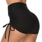 High-waisted black ruched sports shorts with side drawstring, textured fabric, perfect for gym workouts, yoga, and activewear fashion.
