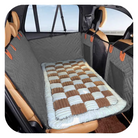 Gray pet car seat cover with quilted design, protecting vehicle interior. Durable, waterproof, non-slip mat for dogs. Ideal for travel safety.