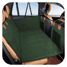 Green pet car seat cover in SUV, waterproof and scratch-proof, providing protection for vehicle seats. Ideal for pet travel and car interior care.