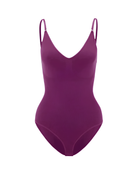 Purple shapewear bodysuit with adjustable straps, seamless design, and V-neckline. Perfect for slimming, body contouring, and enhancing curves.