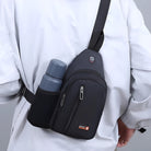 Man wearing a black crossbody sling bag with a water bottle in the side pocket, ideal for travel and outdoor activities. Stylish and functional accessory.