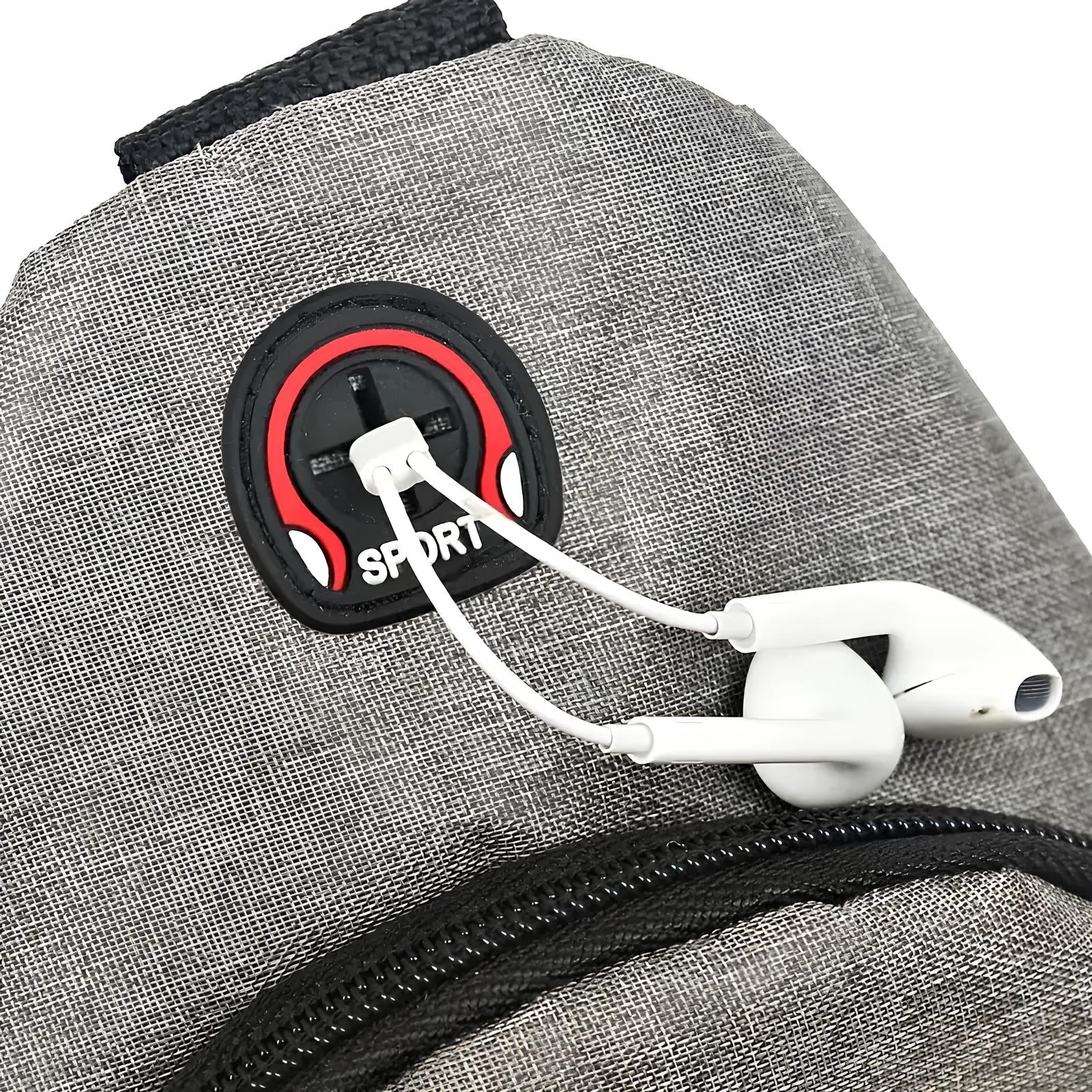 Gray backpack with built-in headphone port, featuring white earphones. Ideal for travel and sports. Durable fabric, modern design, convenient audio access.