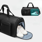 Black gym duffel bag with shoe compartment, featuring white sneakers. Includes side pocket with Nike shoe illustration. Ideal for sports and travel.