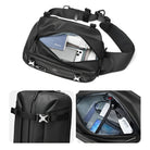 Black waterproof crossbody sling bag with adjustable strap, featuring multiple compartments for tech gadgets, travel essentials, and secure buckle closure.