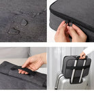 Waterproof gray travel bag with zipper closure, durable fabric, and convenient handle, designed for easy attachment to luggage. Perfect for travel.