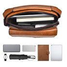 Brown leather messenger bag with top zipper open, displaying books and a tablet inside. Accessories include a watch, umbrella, wallet, and smartphone.