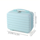 Light blue hard-shell travel makeup case with handle, compact size 31cm x 23cm x 15cm, ideal for cosmetics storage, portable beauty organizer.