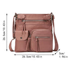 Women's pink crossbody bag with multiple zippered pockets, adjustable strap, and compact design. Ideal for travel and everyday use. Dimensions: 26.5cm x 26.5cm x 5cm.