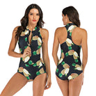 Women's black one-piece swimsuit with vibrant pineapple print, featuring a front zipper and racerback design. Perfect for summer beachwear.