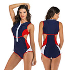 Women's sporty one-piece swimsuit, navy blue with red and white accents, front zipper, sleeveless design, ideal for swimming and beach activities.