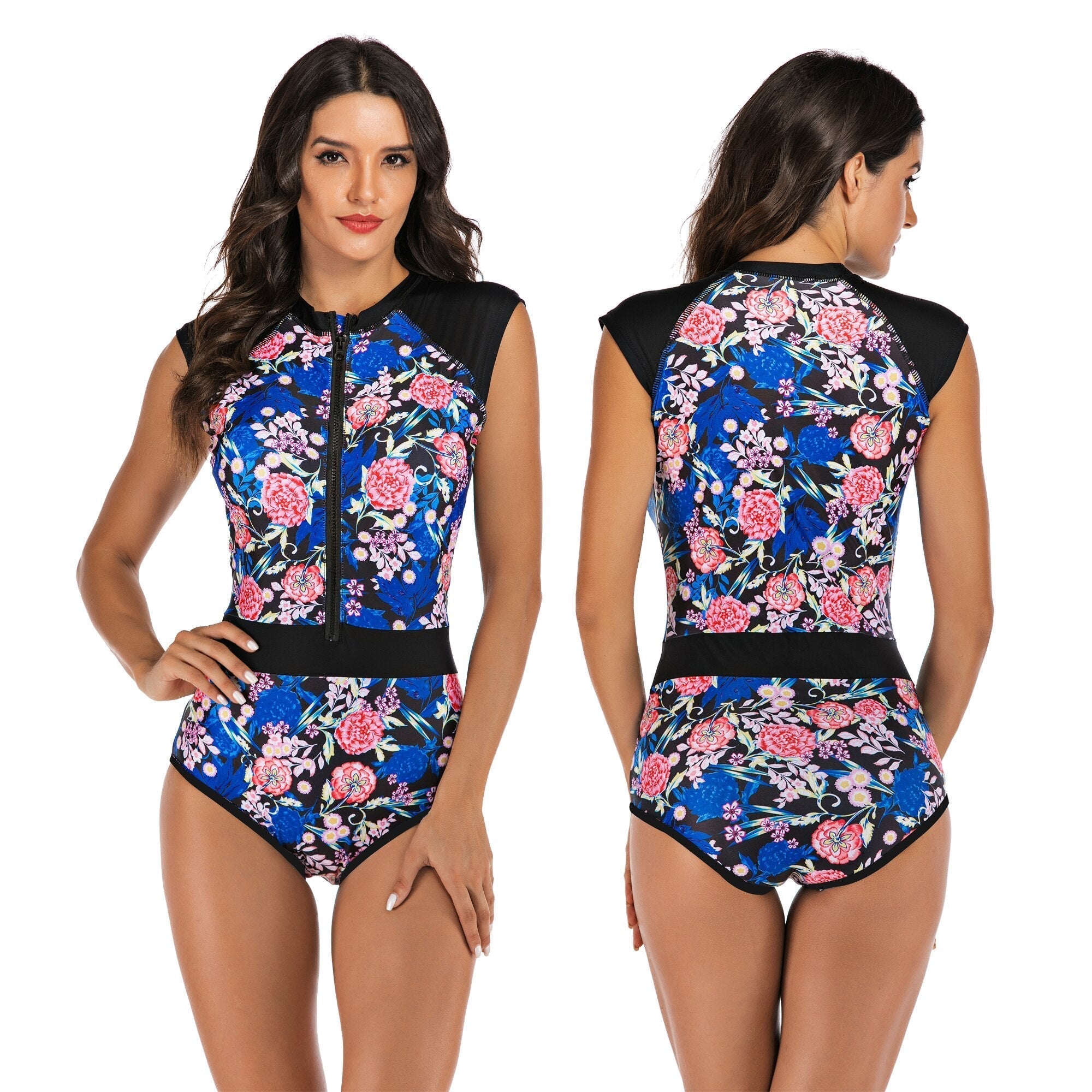 Women's navy floral one-piece swimsuit with front zipper, cap sleeves, and vibrant pink and blue flower pattern. Sporty swimwear for beach or pool.