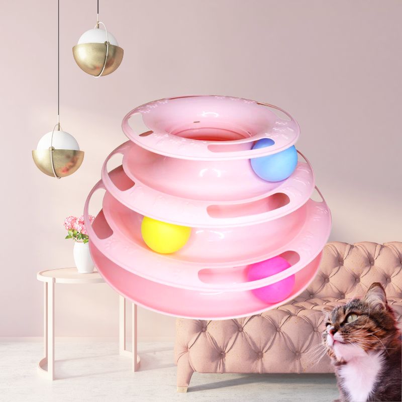 Pink cat toy with multi-level tracks and colorful balls, ideal for interactive play. Perfect for keeping cats entertained and active indoors.