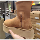 Tan suede snow boot with plush lining, waterproof design, anti-slip sole, and side zipper. Ideal for winter outdoor activities. Women's fashion footwear.