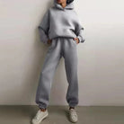 Gray sweatshirt set with hoodie and jogger pants, featuring a relaxed fit. Perfect for casual wear, loungewear, or athleisure fashion.