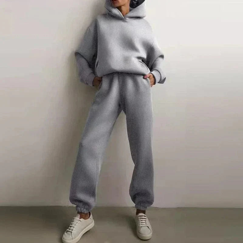 Gray sweatshirt set with hoodie and jogger pants, featuring a relaxed fit. Perfect for casual wear, loungewear, or athleisure fashion.