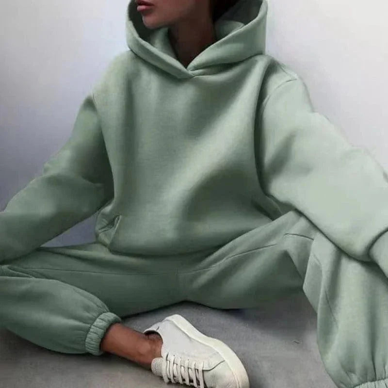 Mint green oversized sweatshirt set with hood, featuring relaxed fit and matching joggers. Perfect for casual wear and loungewear fashion trends.