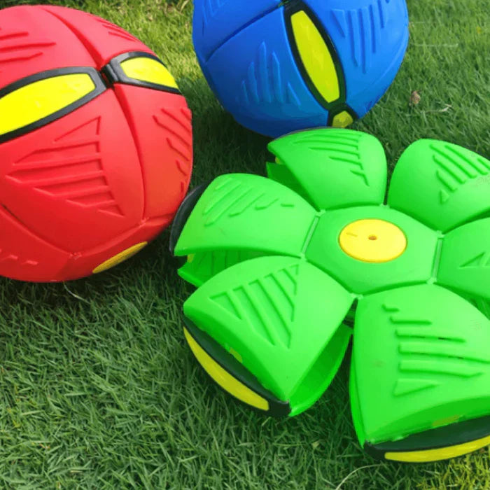 Colorful transforming toy balls on grass, featuring red, blue, and green designs. Perfect for outdoor play, durable, and engaging for kids.